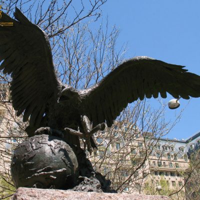 bronze eagle statue with globe