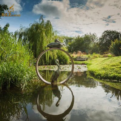 Outdoor beautiful life size brass pelican at holiday lakes