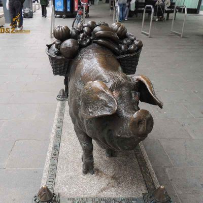 Plaza street decor copper pig holding things sculpture